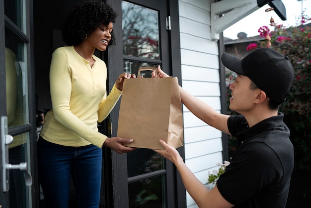 Free photo delivery person getting parcel out for delivery