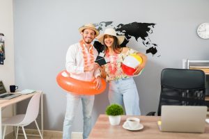 Excited to go on our cruise trip. hispanic beautiful couple with hawaiian clothing travel agency ready to go on a tropical vacation